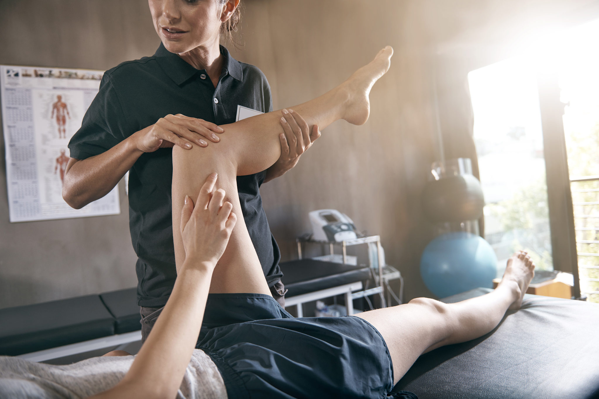 photo of man receiving physical therapy treatment